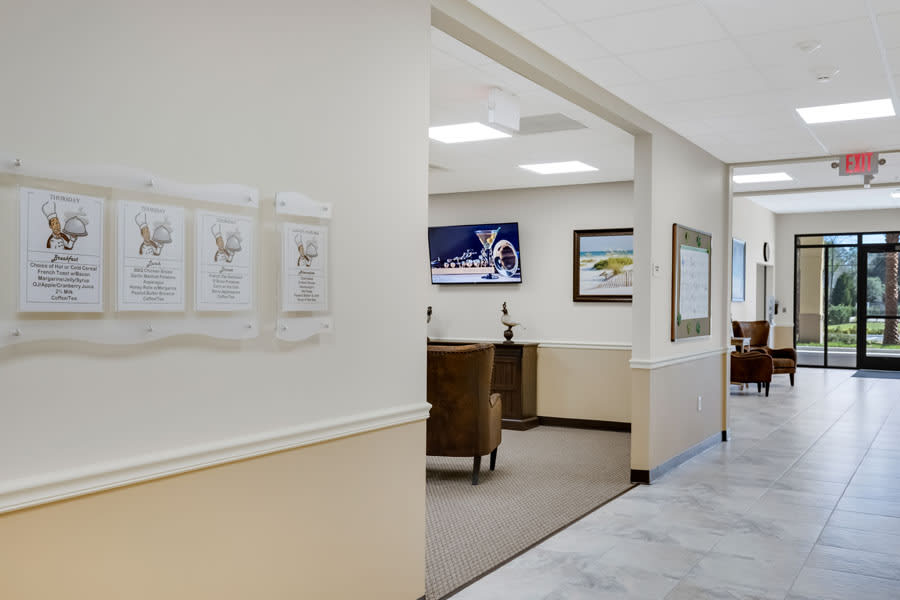 A view of a clinic waiting area and reception desk.