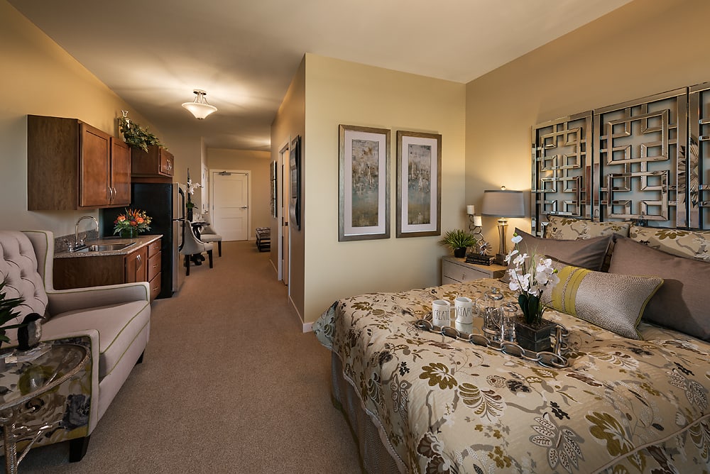 A cozy bedroom with elegant interior design and decor, featuring a comfortable bed and warm lighting.