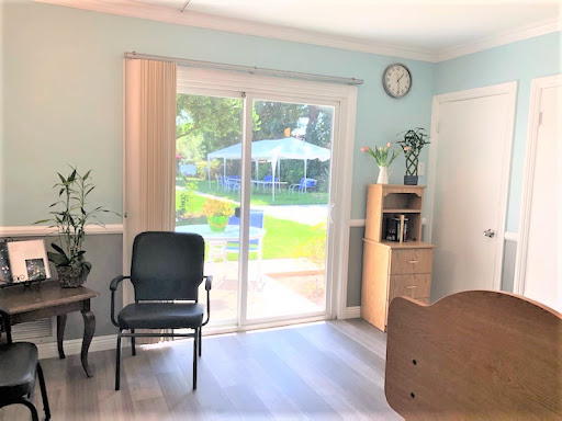 A bright and inviting living space with a sliding door leading to an outdoor area.