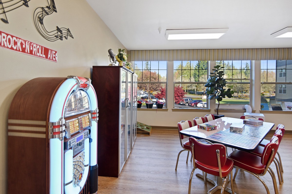 A retro-style diner interior featuring a jukebox and a seating area.