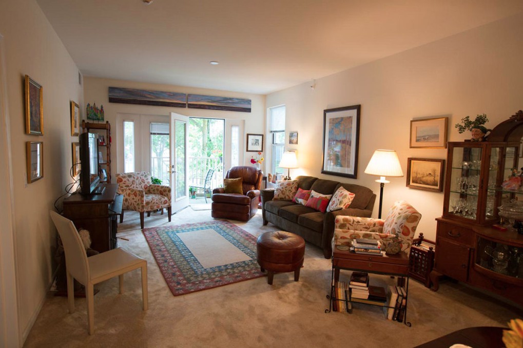 Cozy living room with comfortable seating and natural light.