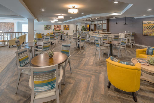 A vibrant and stylish dining area featuring modern furniture and a welcoming atmosphere.
