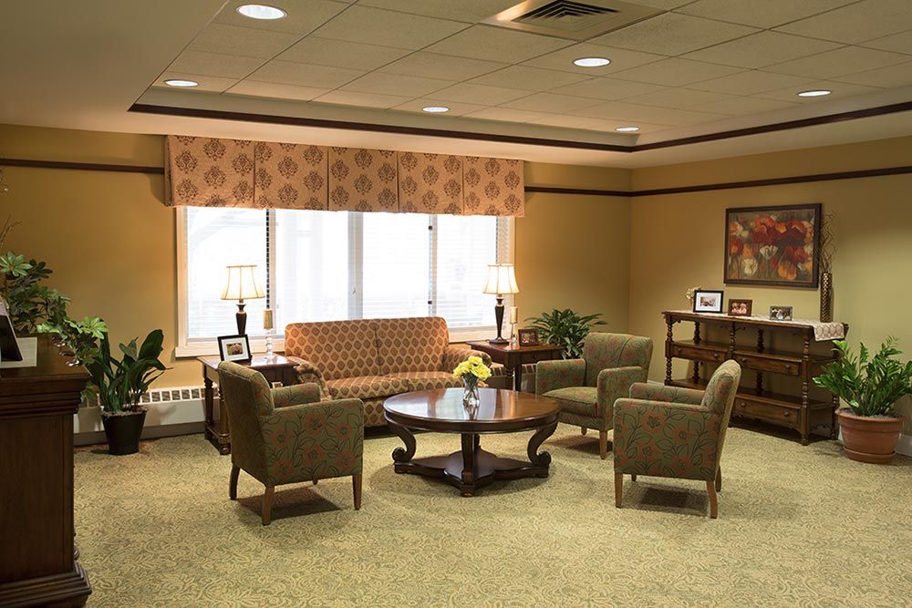 A cozy living room with comfortable seating and warm lighting.