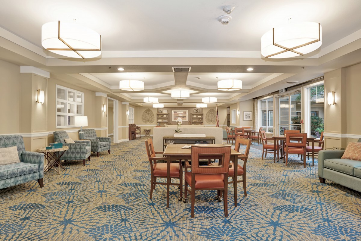 A well-lit hotel lobby featuring comfortable seating and modern decor.