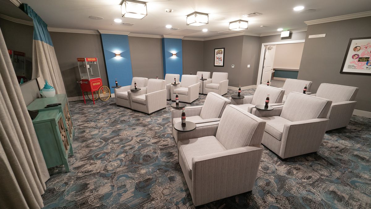 A modern home theater with comfortable seating and stylish interior design.
