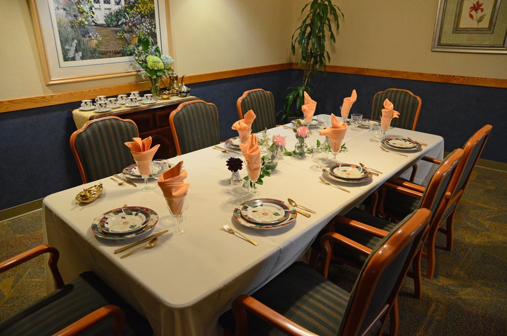 A neatly set dining table prepared for a formal dinner.