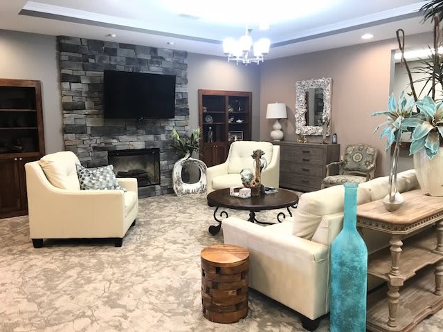 A modern living room with cozy seating and elegant decor.