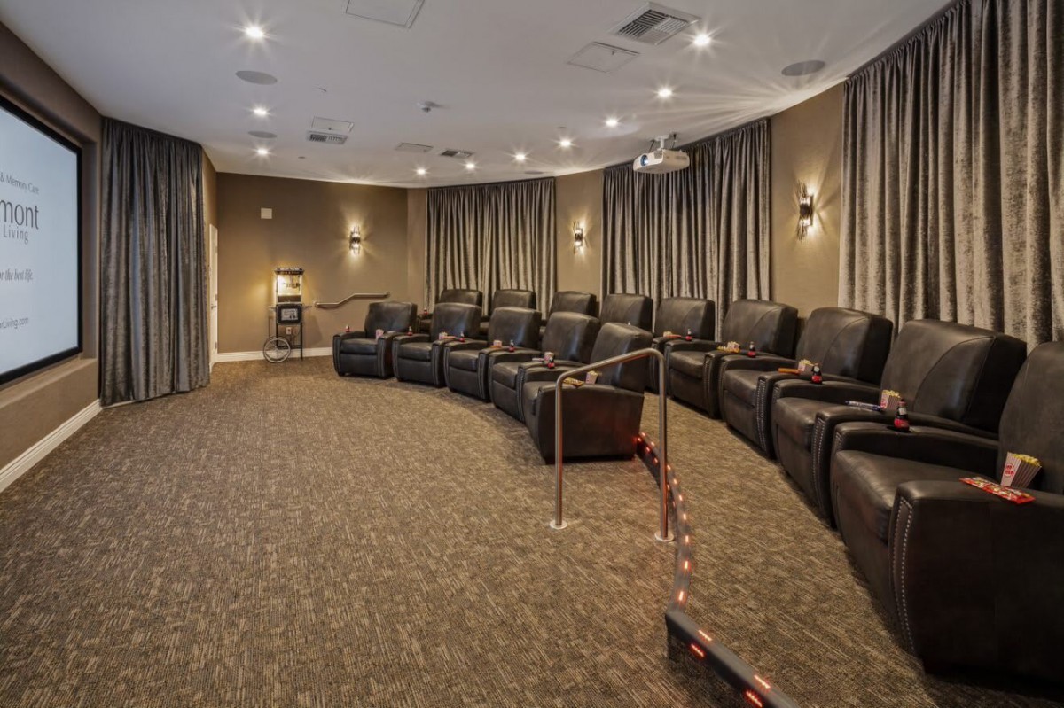 A cozy home theater with reclining seats and elegant decor.