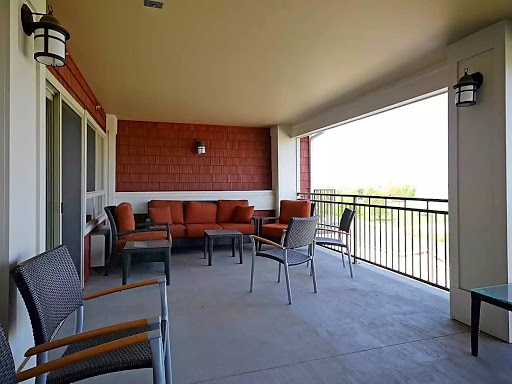 A spacious balcony featuring comfortable outdoor seating, perfect for enjoying the scenic views.