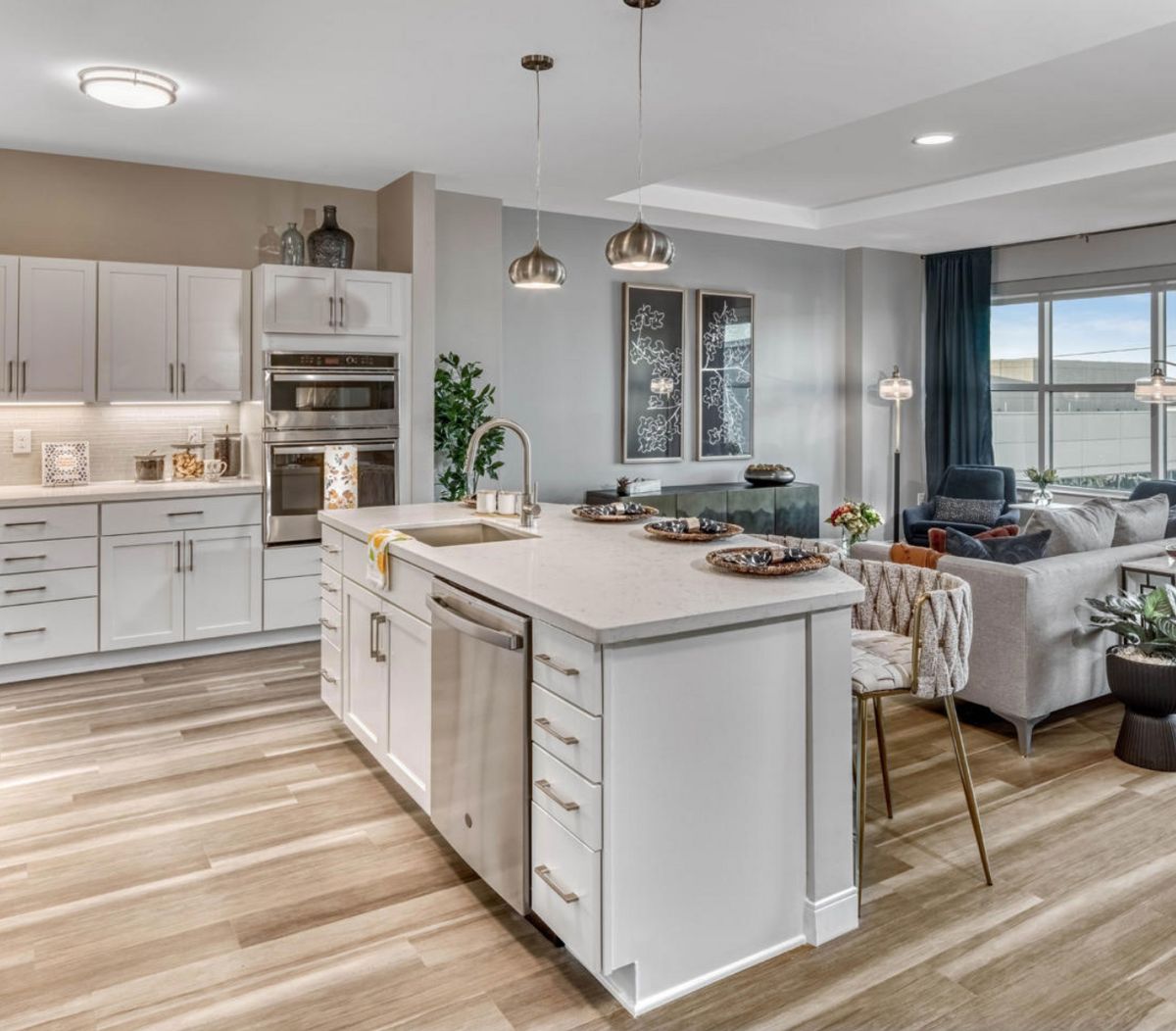 Modern open-concept kitchen and living area with a central island.