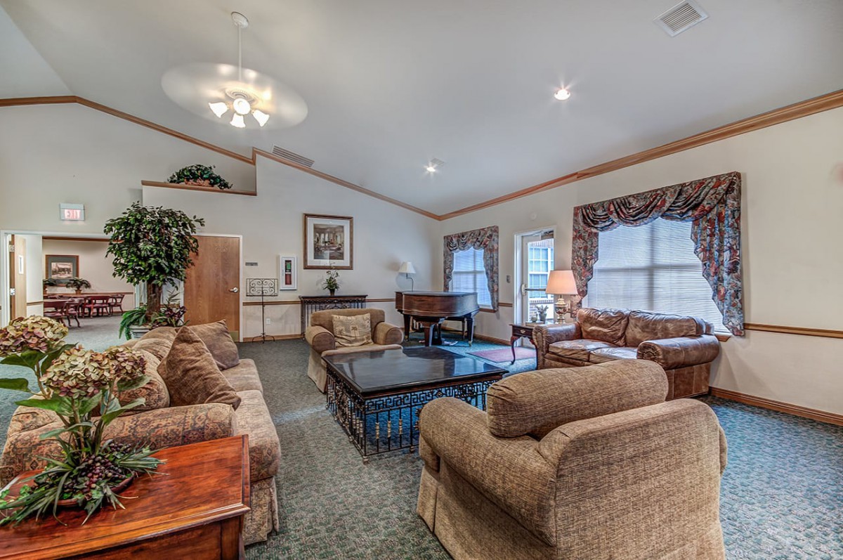 A spacious living room with comfortable seating and elegant decor.