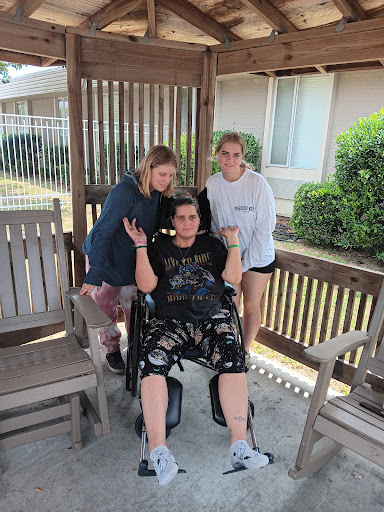 A joyful moment shared among friends, enjoying time outdoors.