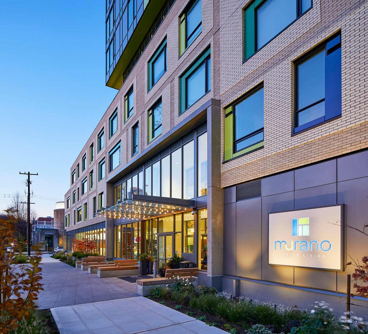 A modern hotel building with a welcoming entrance in an urban setting.