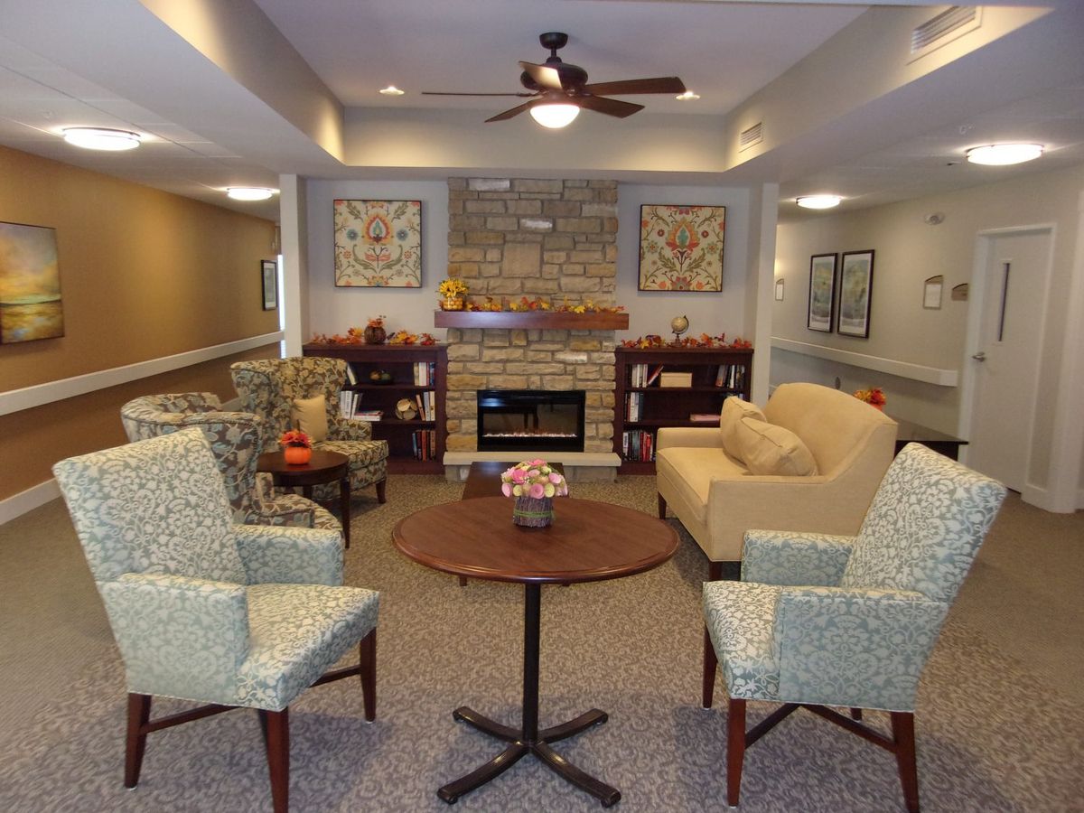 A cozy living room with comfortable seating and a fireplace.