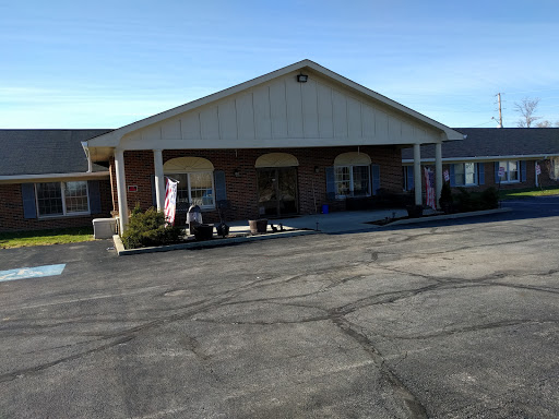 A view of a commercial building with an inviting entrance on a clear day.