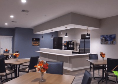 A modern kitchen and dining area with stylish furniture and appliances.