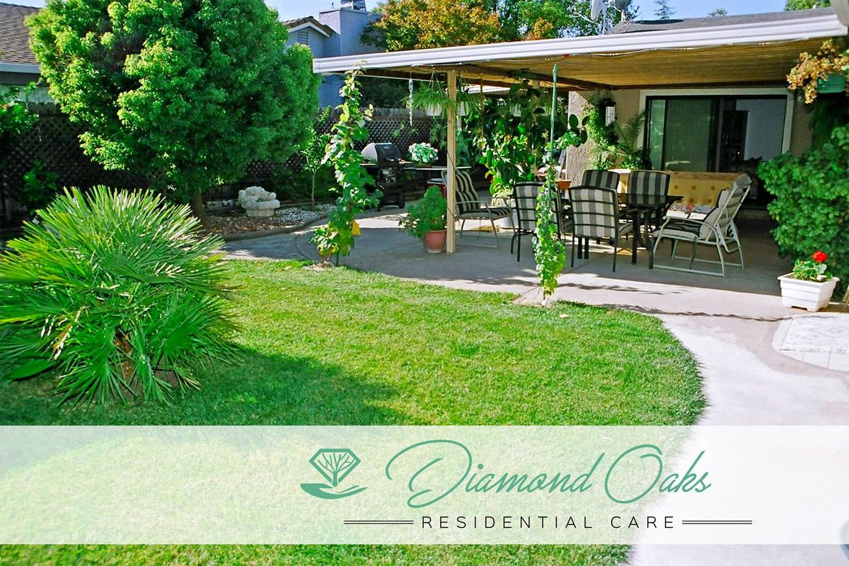 A peaceful residential garden patio with lush greenery and outdoor furniture.