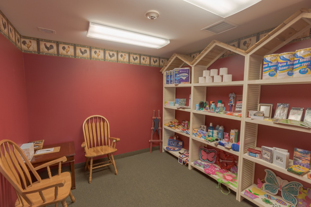 A cozy children's room with shelves stocked with toys and books.
