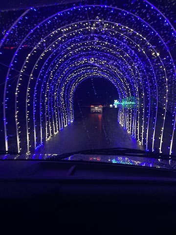 Driving through a mesmerizing blue light tunnel.