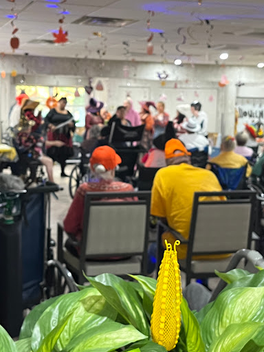 A lively musical performance entertaining residents at a senior living facility.