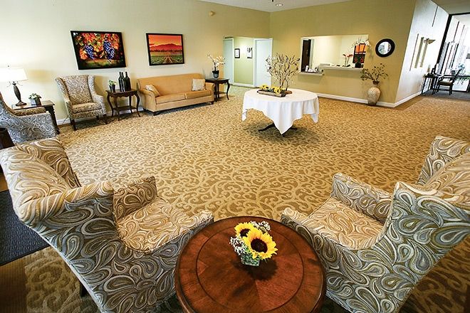 A spacious and elegantly decorated lobby with comfortable seating arrangements.
