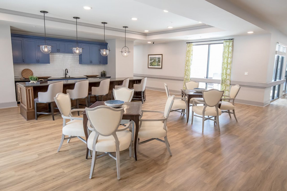 A modern dining area with elegant furniture and stylish lighting.