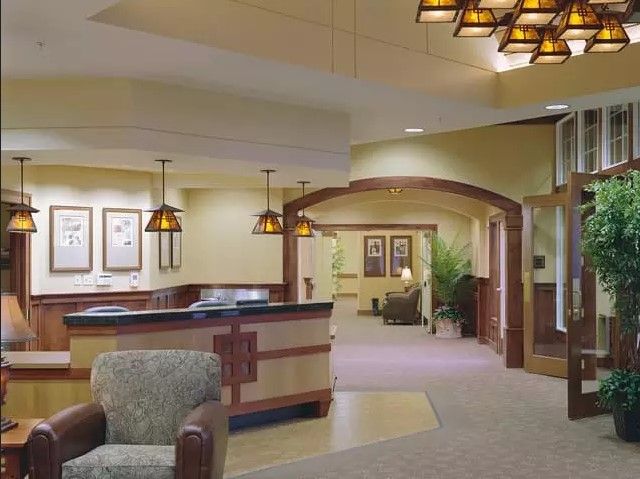 A well-lit lobby and reception area with comfortable seating and modern decor.