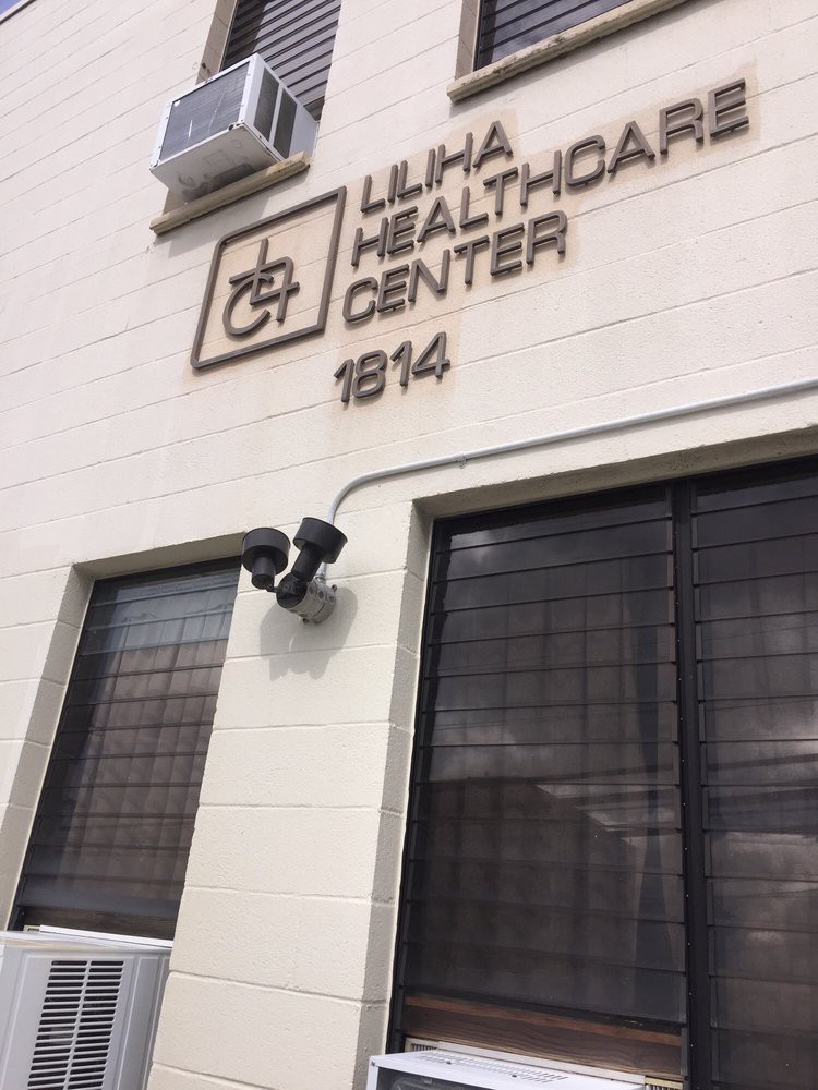 Exterior view of the Liliha Healthcare Center with visible security cameras.