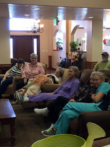 A group of seniors enjoying leisure time together in a cozy seating area.