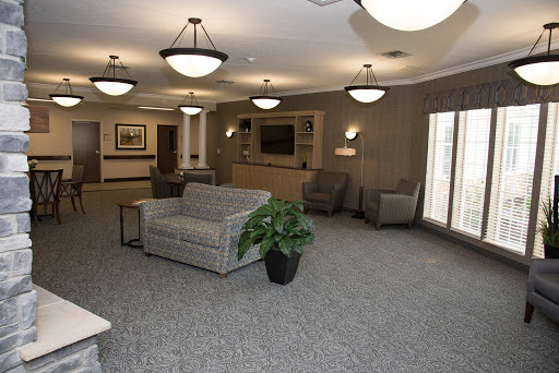 A cozy lounge area featuring comfortable seating and soft lighting.