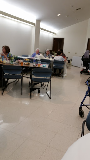 A community gathering for seniors enjoying a meal together.