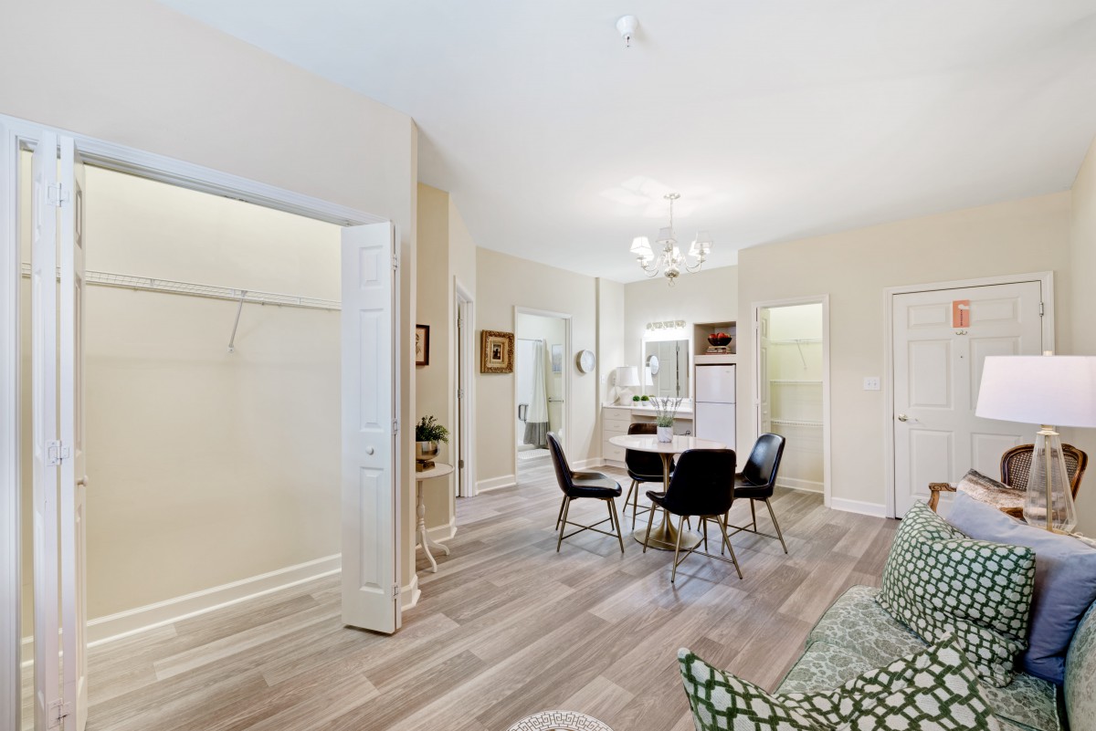 A modern dining area with an open floor plan and sleek furnishings.