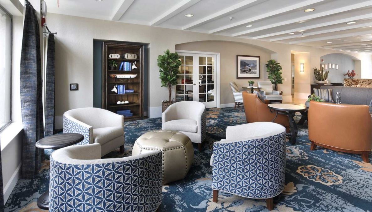 A stylish lobby seating area with modern chairs and decorative elements.