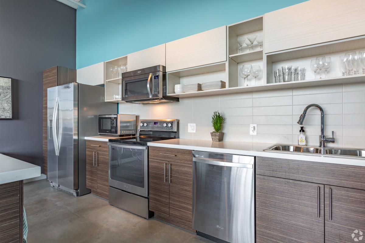 A modern kitchen with stainless steel appliances and sleek cabinetry.