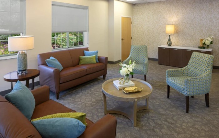 A cozy living room with comfortable seating and warm decor.