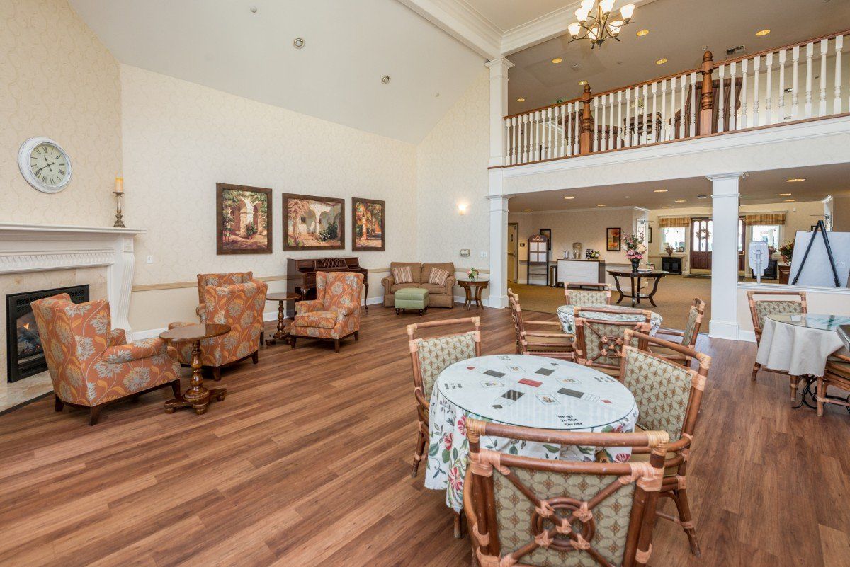 A spacious and elegantly decorated lobby with comfortable seating and artwork on the walls.
