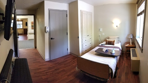 A view of a well-designed patient room in a healthcare facility.