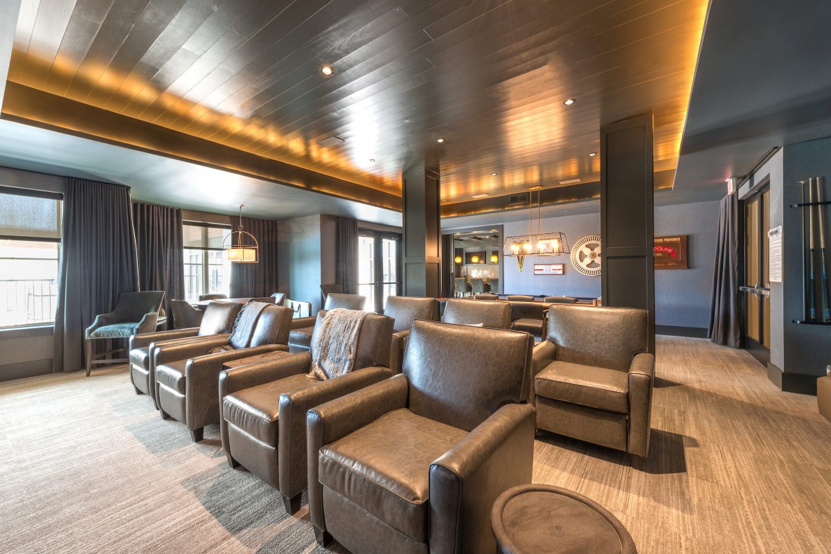 A modern lounge with comfortable seating and elegant lighting.