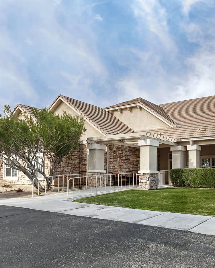 A suburban house with a well-maintained front yard and driveway.