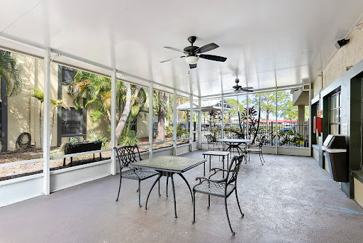 A serene outdoor patio featuring comfortable furniture, perfect for enjoying nature.