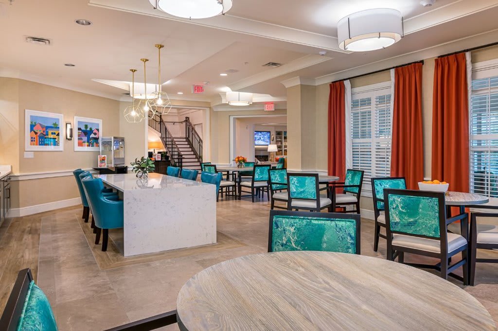 A modern dining area with elegant furniture and stylish lighting.