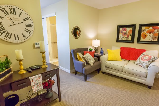 A cozy living room with colorful pillows and stylish decor.