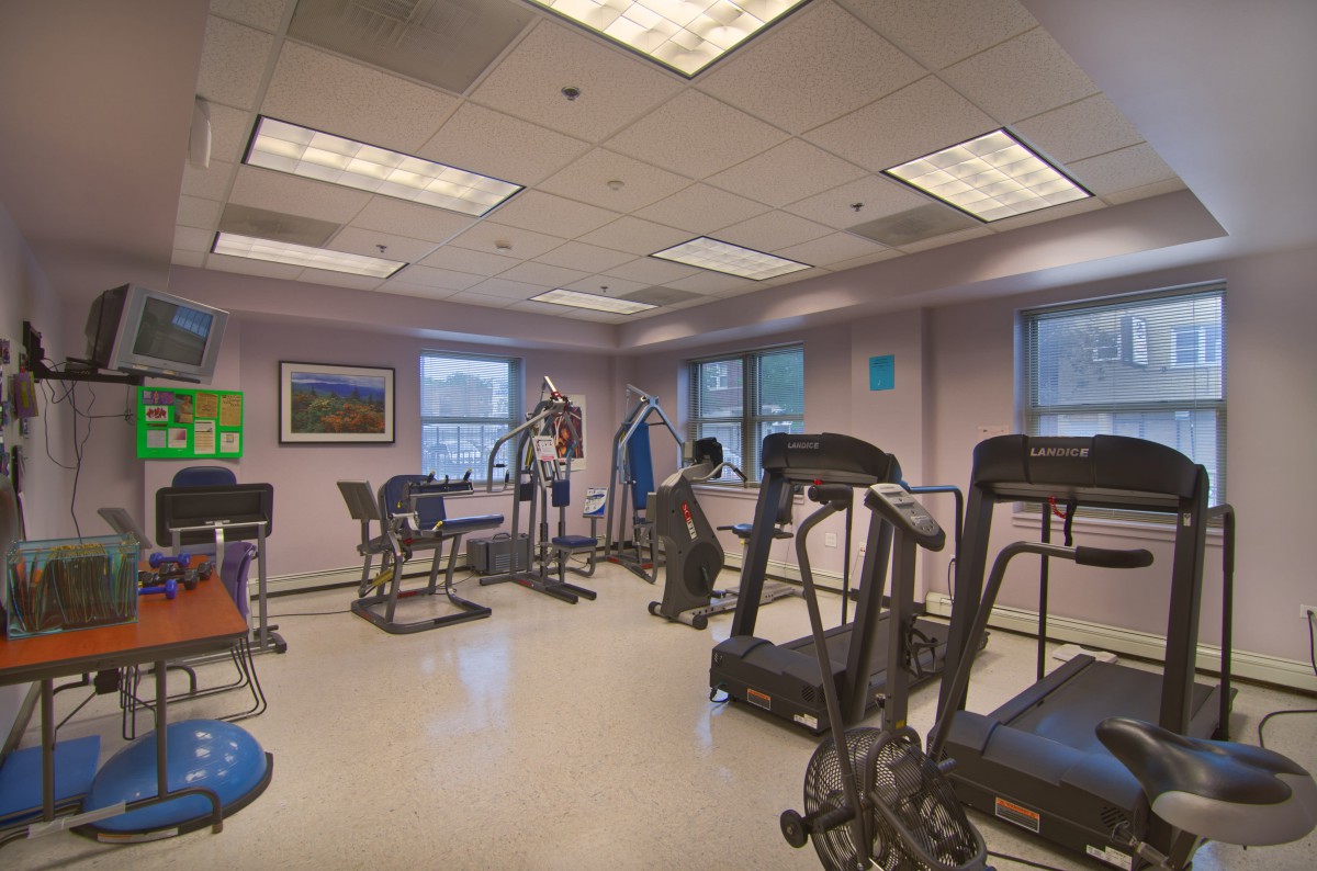A fitness center equipped with treadmills and stationary bikes.