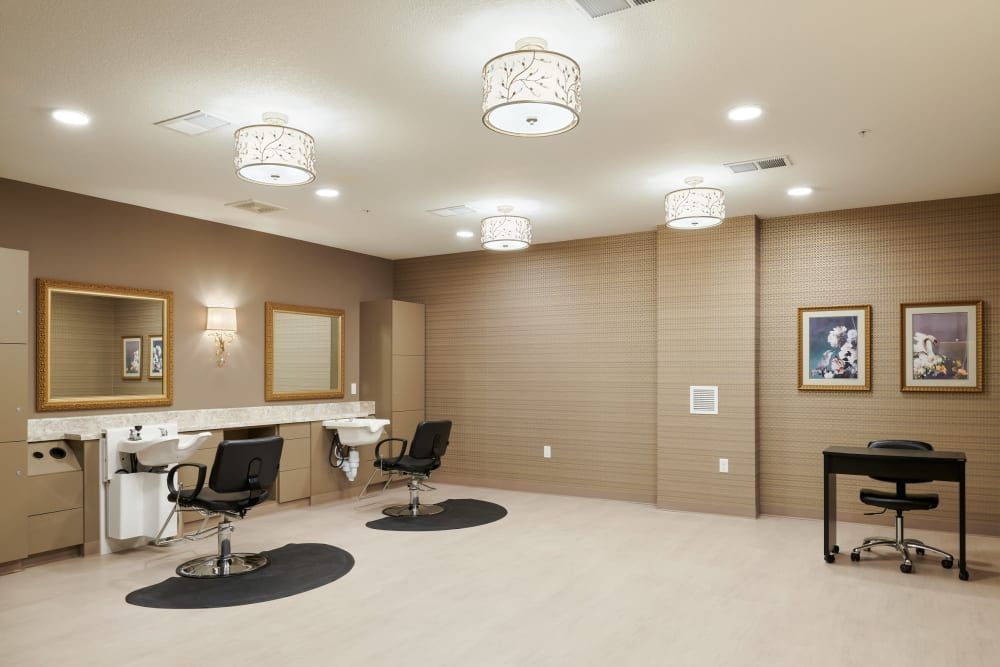 A modern beauty salon interior with styling chairs, mirrors, and elegant lighting.