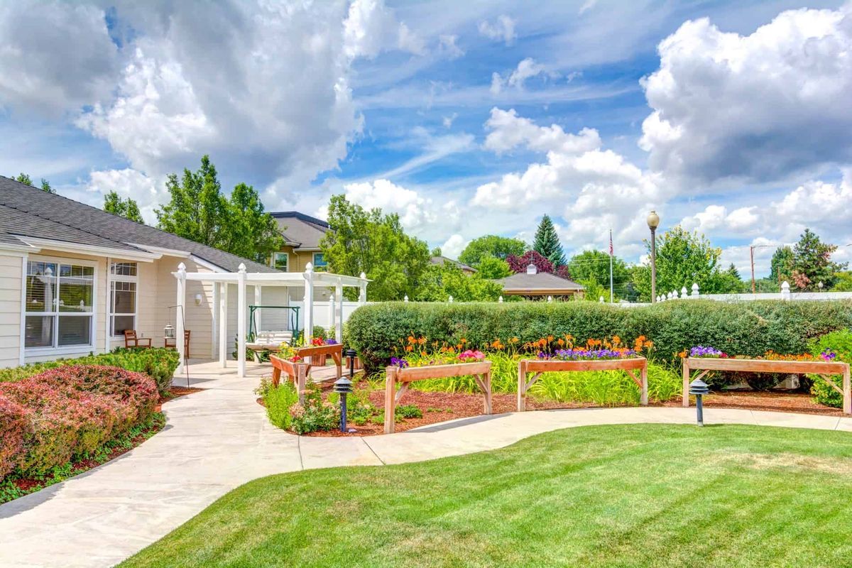 Beautiful garden landscape with a well-maintained lawn and pathway.
