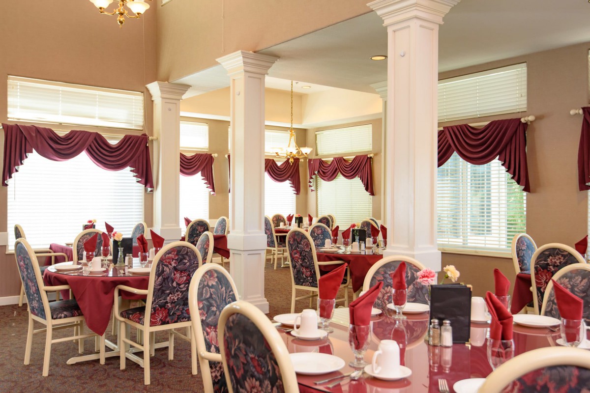 A beautifully decorated restaurant dining room with elegant seating arrangements.