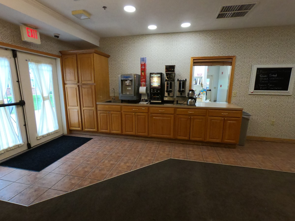 A coffee and beverage station in a hotel lobby.