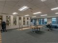 A modern office interior with a conference table and chairs.
