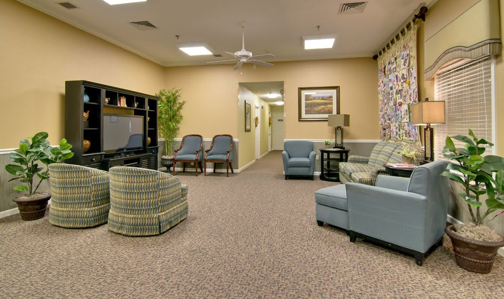 A cozy living room with comfortable seating and a television.