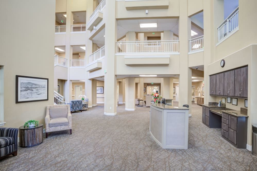 A spacious and modern lobby with bright interiors and comfortable seating.